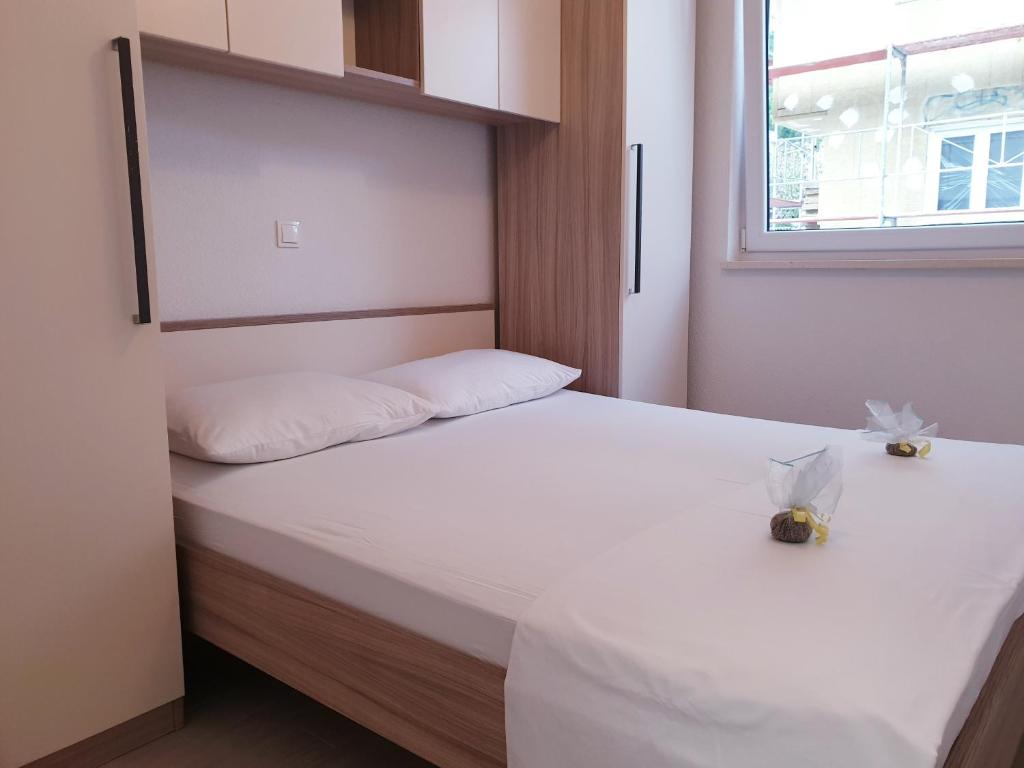 Posteľ alebo postele v izbe v ubytovaní Apartments Ellie