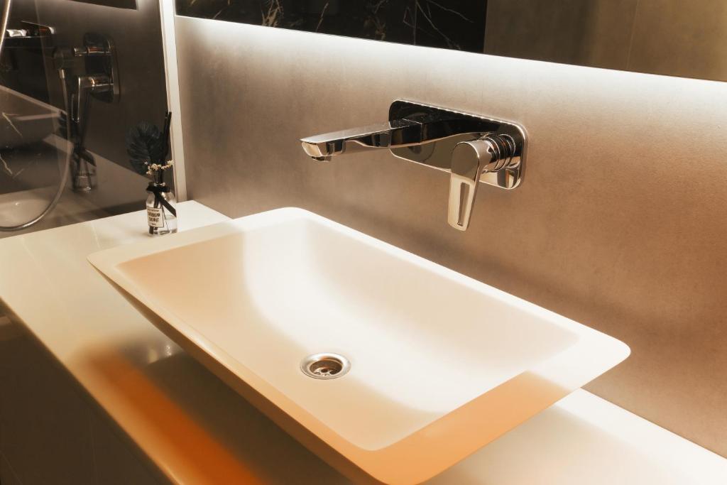 Koupelna v ubytování Apart Hotel на Трояндовой