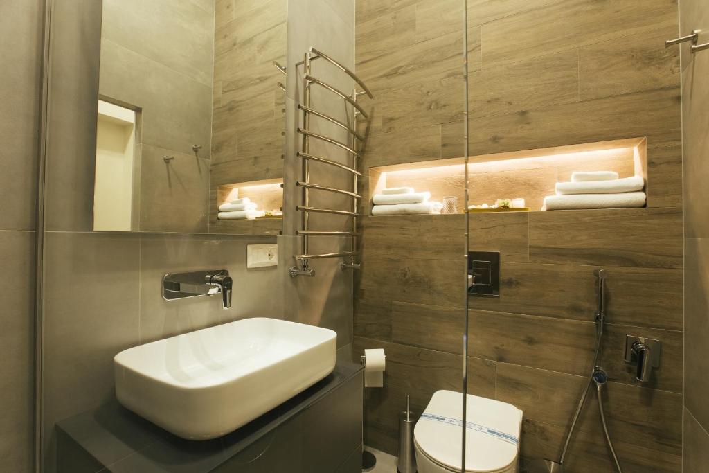 Koupelna v ubytování Apart Hotel на Трояндовой