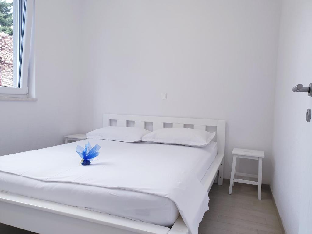 Posteľ alebo postele v izbe v ubytovaní Apartments Ellie
