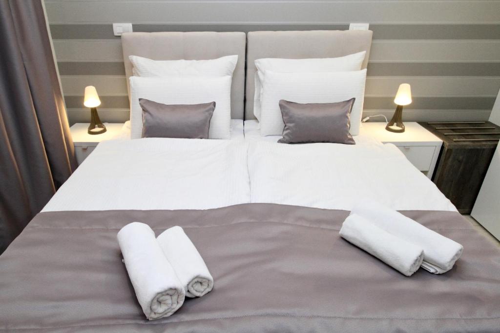 Postel nebo postele na pokoji v ubytování PLATINUM ROOMS butique hotel