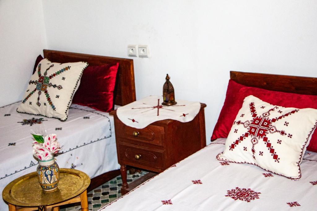 Postel nebo postele na pokoji v ubytování Riad Dar Senhaji