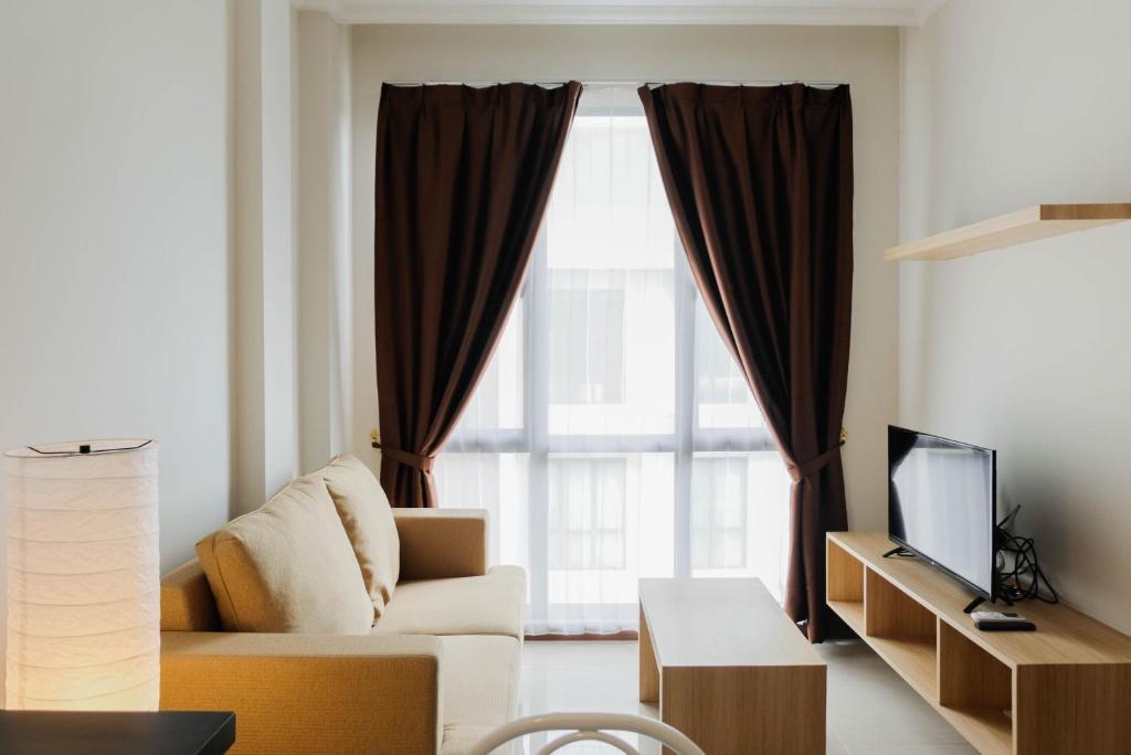 Homey and Simple 1BR at Asatti Apartment By Travelio - Apartamento De Un Dormitorio
