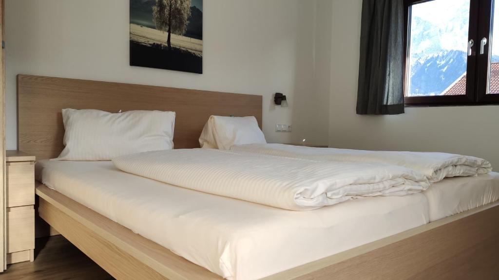 Postel nebo postele na pokoji v ubytování Gästehaus Maria