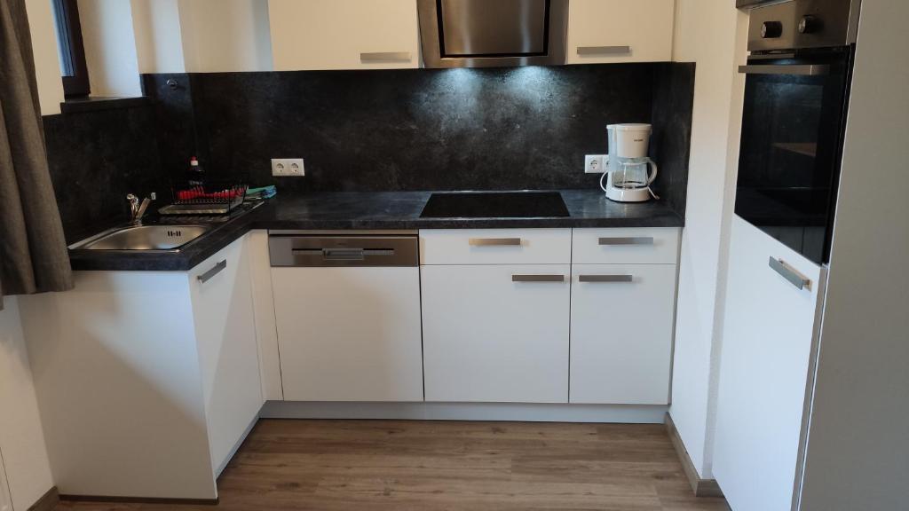 Kuchyň nebo kuchyňský kout v ubytování Gästehaus Maria