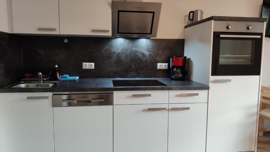 Kuchyň nebo kuchyňský kout v ubytování Gästehaus Maria