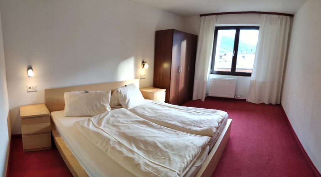 Postel nebo postele na pokoji v ubytování Gästehaus Maria
