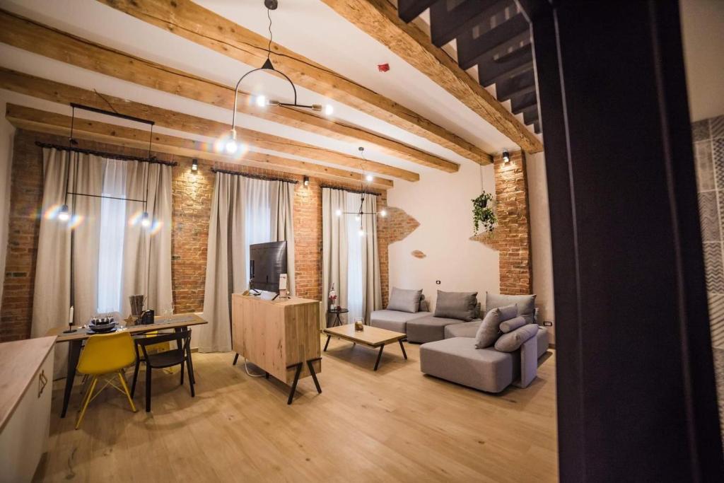 a living room with a couch and a table at Casa Verde - Brasov Homes in Braşov