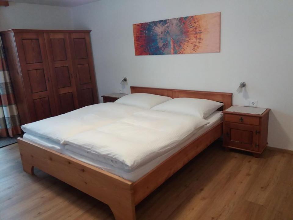 A bed or beds in a room at Gästeheim Pötscher
