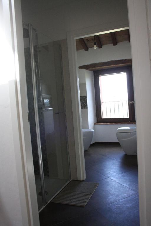 Łóżko lub łóżka w pokoju w obiekcie L'ALPACA DELLA ROSSA - AGRITURISMO