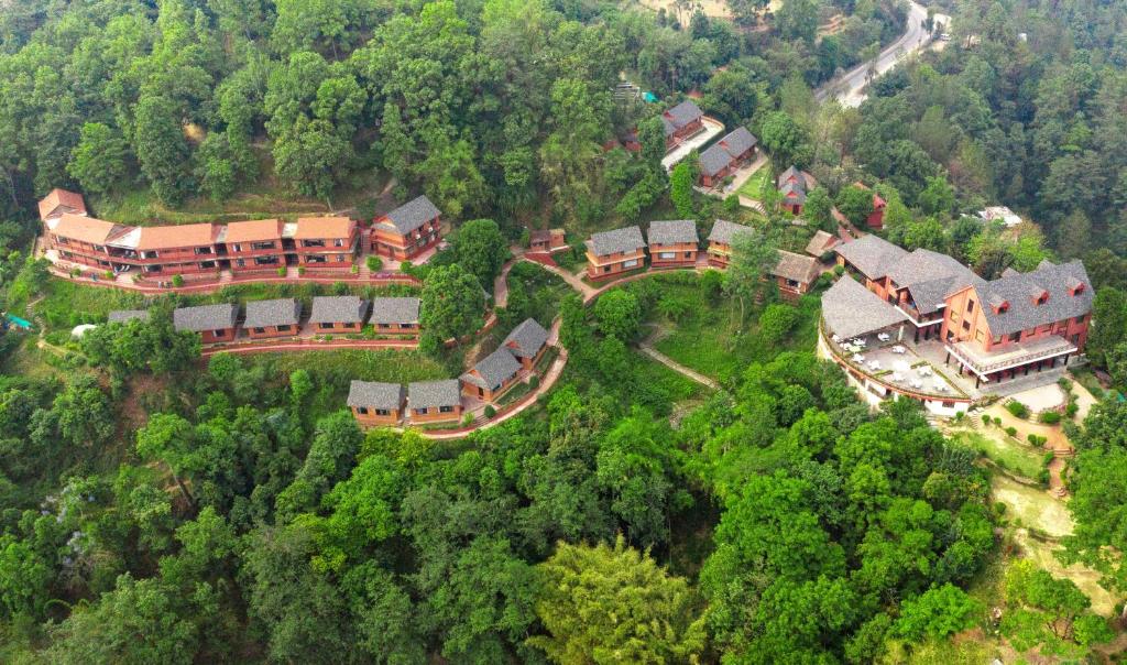 an aerial view of a large house in the forest at Dhulikhel Mountain Resort in Dhulikhel