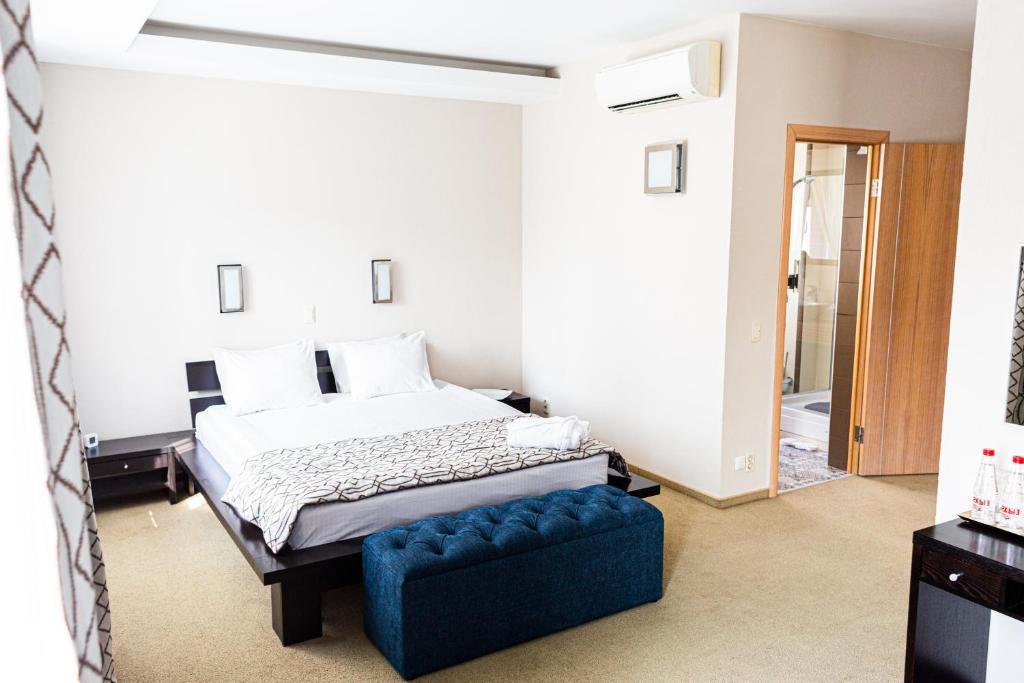 Кровать или кровати в номере Grand Hotel Perm