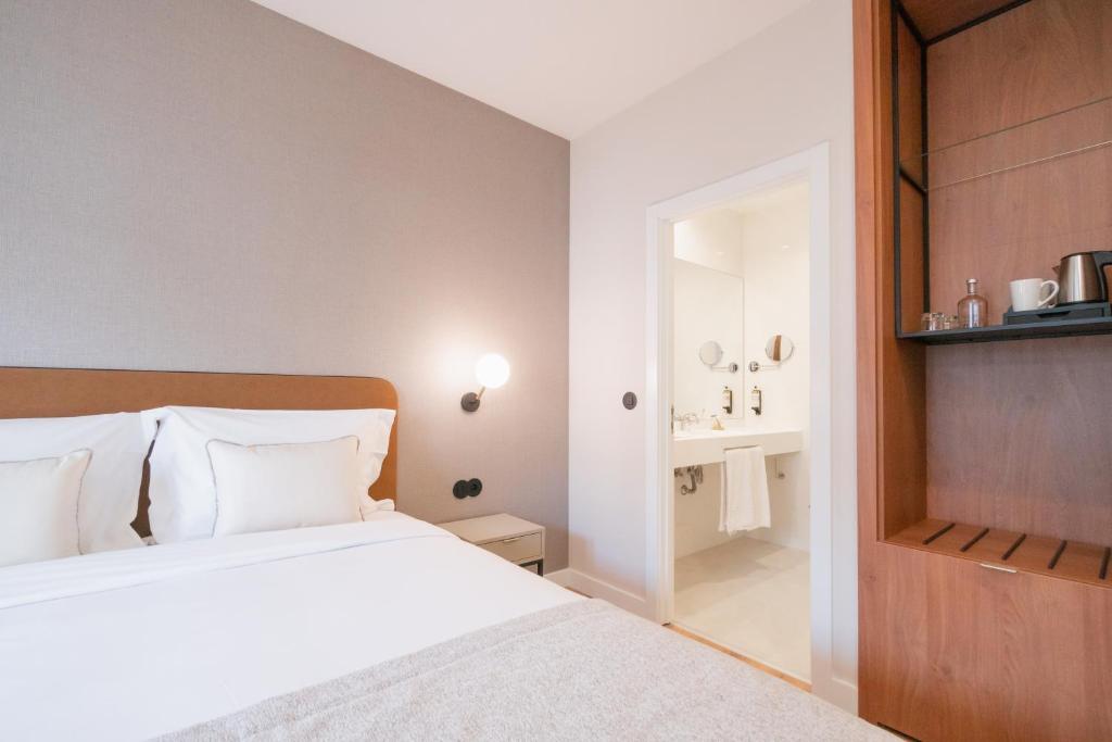 Postel nebo postele na pokoji v ubytování LX SoHo Boutique Hotel by RIDAN Hotels