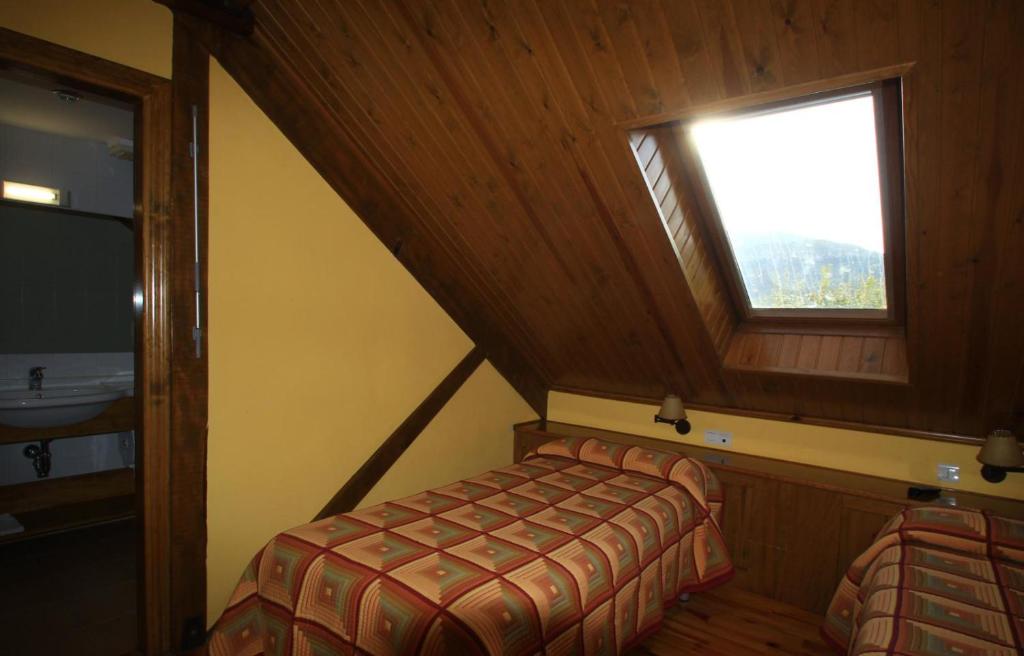 Postel nebo postele na pokoji v ubytování Hotel, Bungalows y Camping Viu