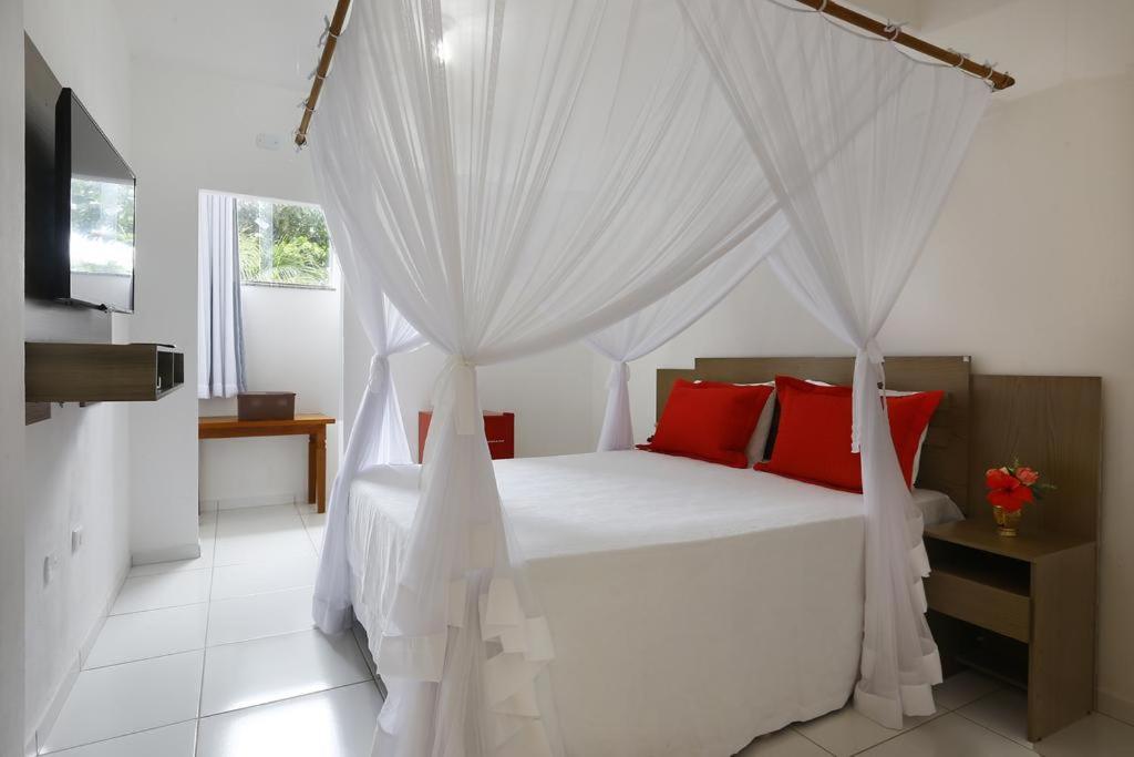 En eller flere senge i et værelse på Pousada Sol & Mar