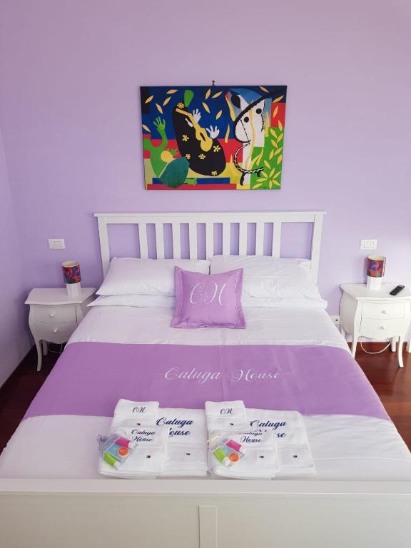 Postel nebo postele na pokoji v ubytování Caluga House