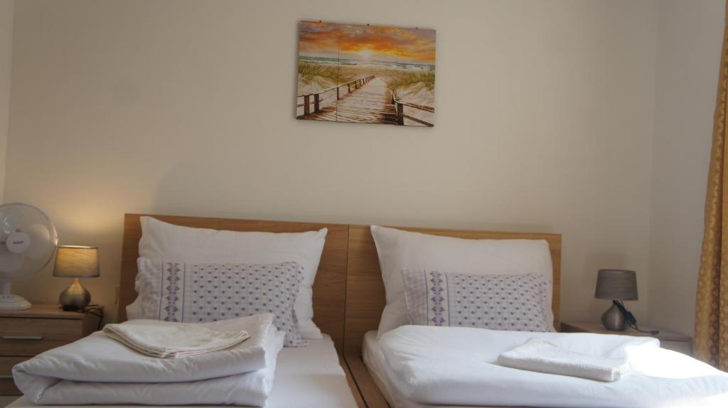 Łóżko lub łóżka w pokoju w obiekcie KK Apartments