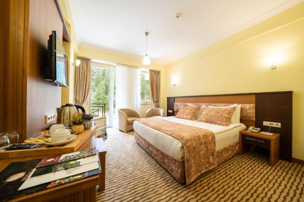 Postel nebo postele na pokoji v ubytování Ridos Thermal Hotel & Spa