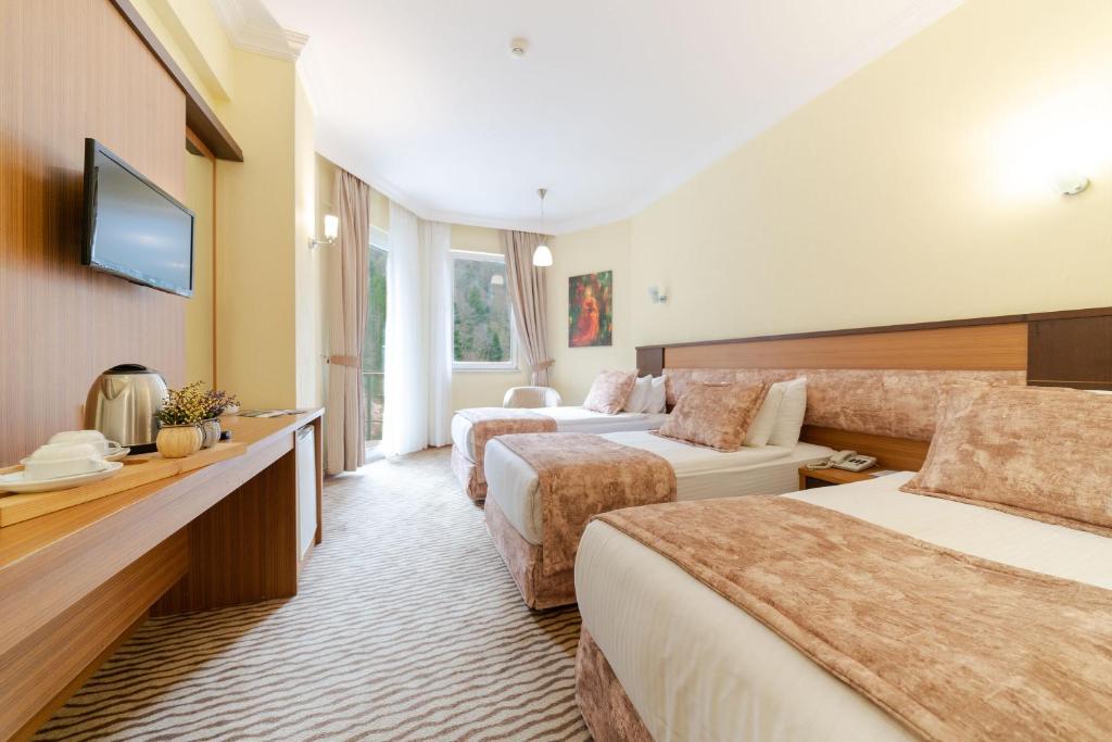 Postel nebo postele na pokoji v ubytování Ridos Thermal Hotel & Spa