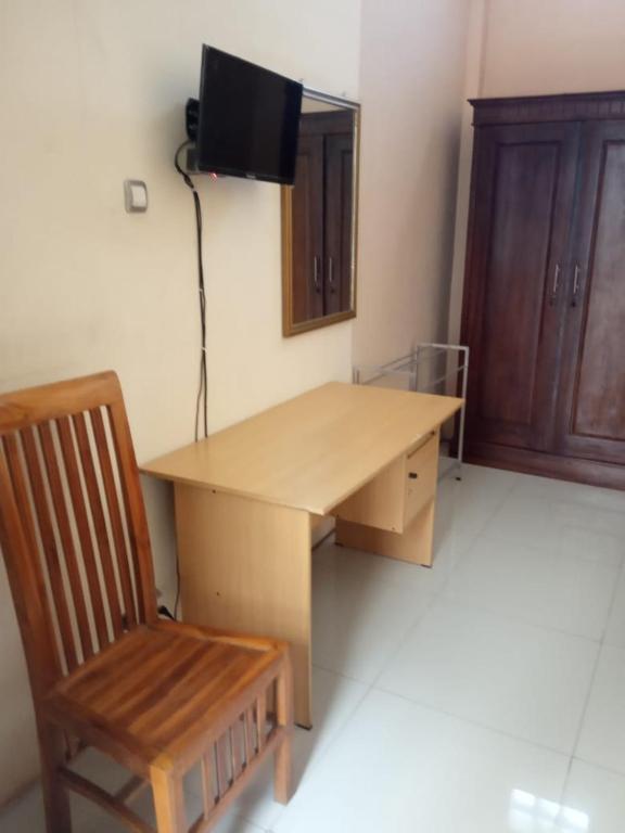 TV o dispositivi per l'intrattenimento presso Hotel Surya Utama - Syariah