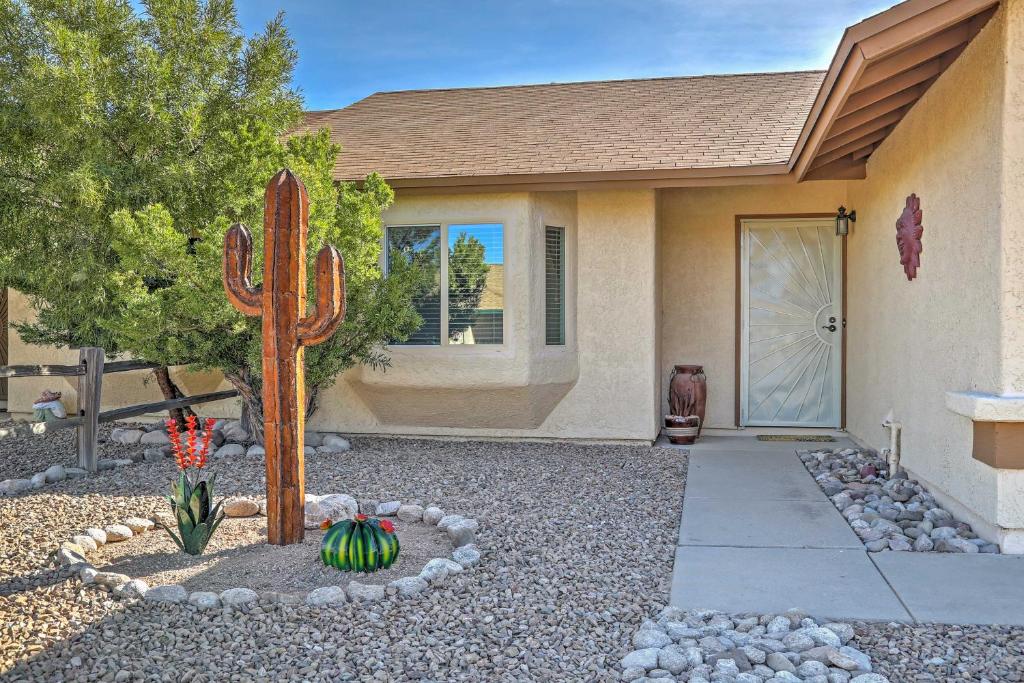 a house with a cactus in front of a house at East Tucson House with Private Backyard and Fire Pit in Tucson