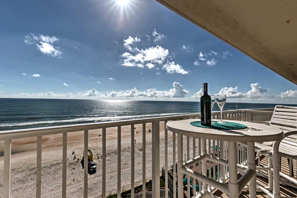 a view of the beach from the balcony of a beach house at Daytona Beach Resort Condo 1 Mi to Ocean Center! in Daytona Beach