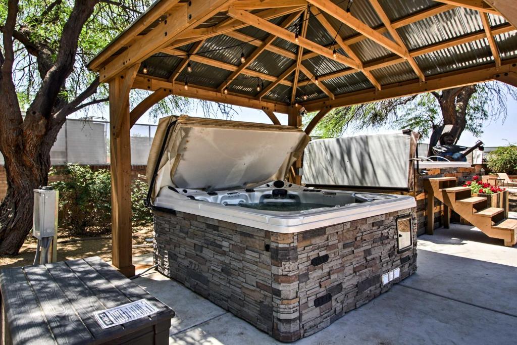 a barbecue grill under a pavilion on a patio at Pet-Friendly Tucson Casita Shared Hot Tub and Porch in Tucson