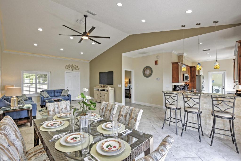 a dining room and living room with a table and chairs at Oceanfront Oasis with Deck, Water Views and Beach Gear in Flagler Beach