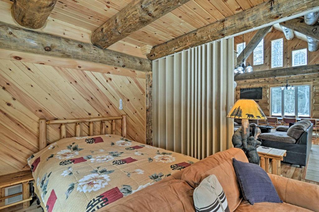 Custom Log Cabin with Deck and 45 Acres by Pine River! - Housity