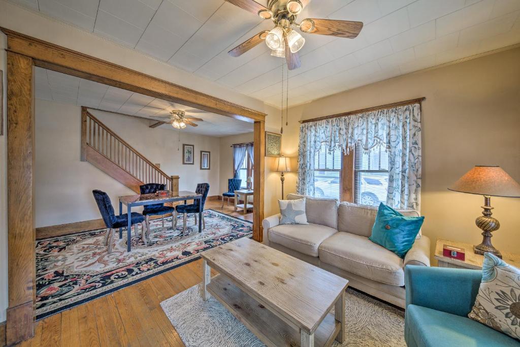 a living room with a couch and a table at Charming Urbana Home Near Downtown! in Urbana