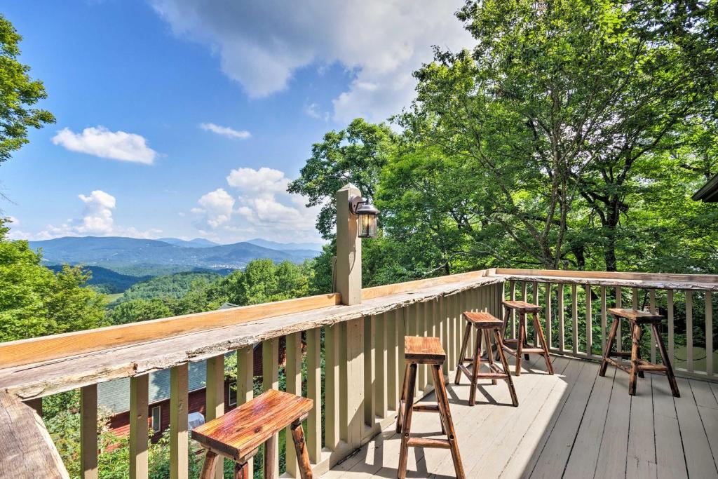 a balcony with stools and tables on a mountain at Cabin with Hot Tub and Mountain Views, Less Than 5 Mi to Boone in Blowing Rock