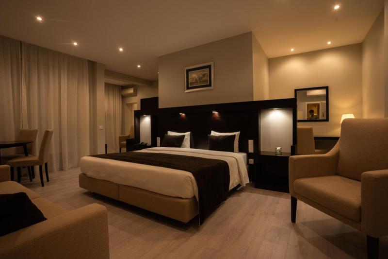 Postel nebo postele na pokoji v ubytování Pao de Acucar Hotel