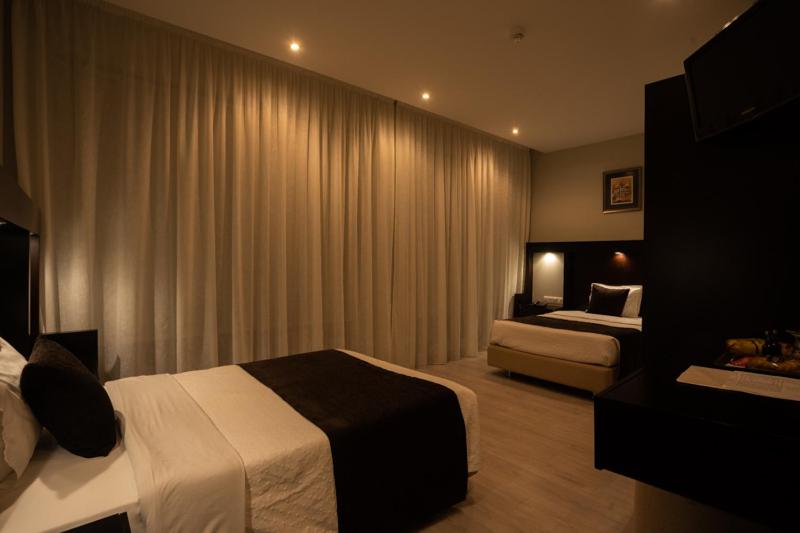 Postel nebo postele na pokoji v ubytování Pao de Acucar Hotel
