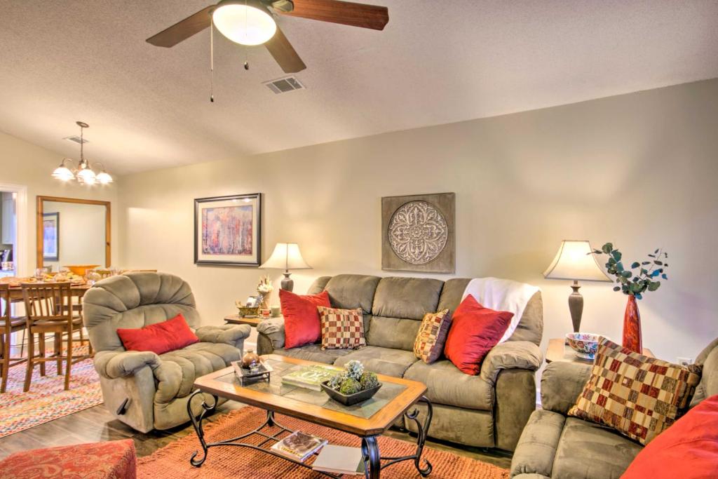 a living room with a couch and a table at Cozy Greenwood Condo with Patio - 2 Mi to Downtown! in Greenwood