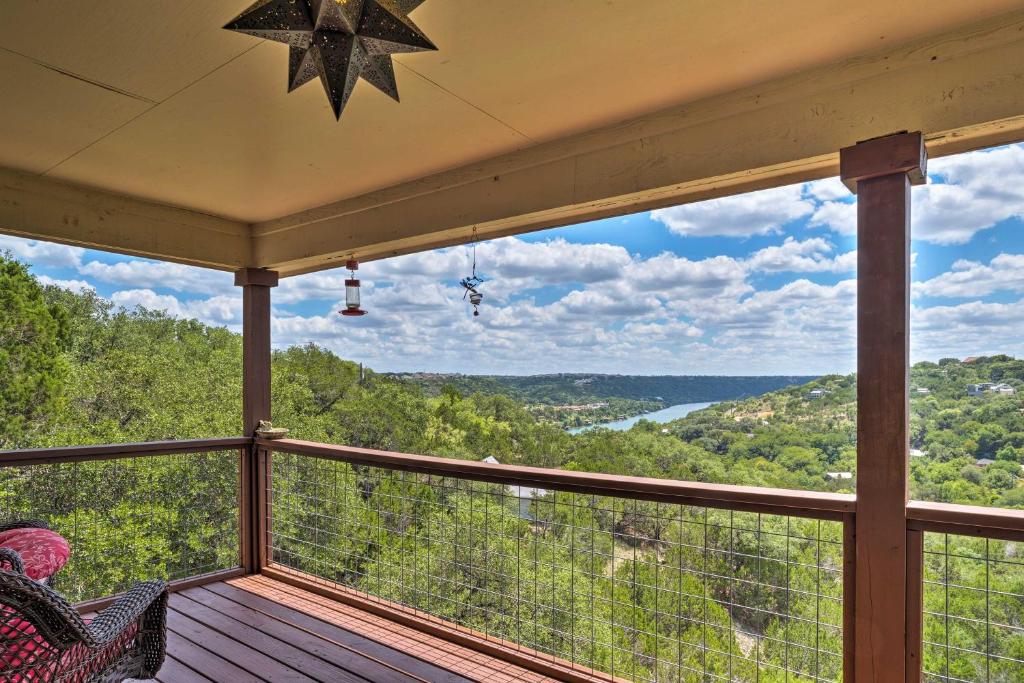 a screened in porch with a view of the mountains at 2 Furnished Decks and Lake Views Austin Escape in Austin