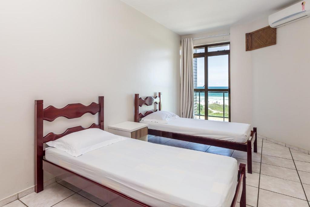 Postel nebo postele na pokoji v ubytování Apart Hotel Porto Príncipe