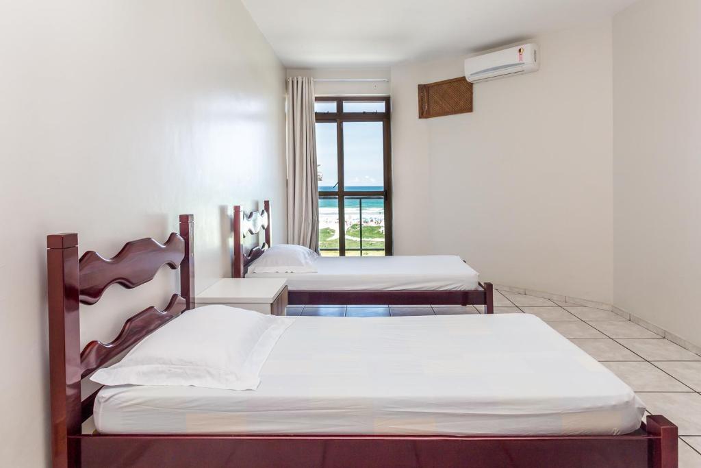Postel nebo postele na pokoji v ubytování Apart Hotel Porto Príncipe