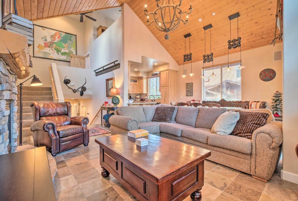 a living room with a couch and a table at Mammoth Lakes Townhome - 10-Min Walk to Village! in Mammoth Lakes