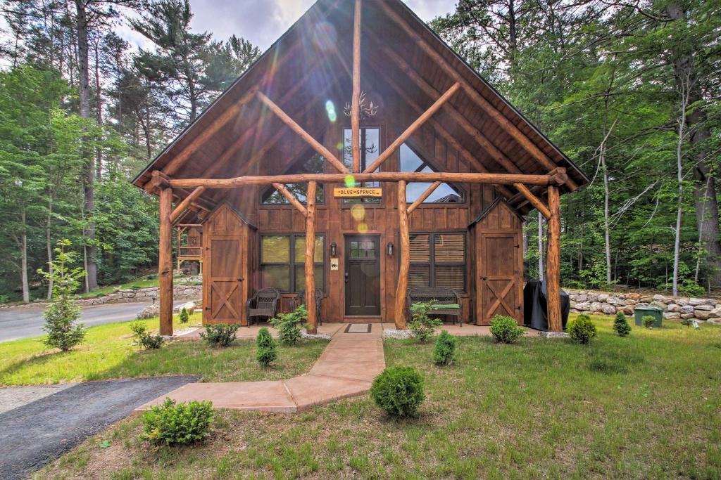 a large wooden cabin with a large front door at Timber Home Walk to Slopes and N Conway Shops! in North Conway