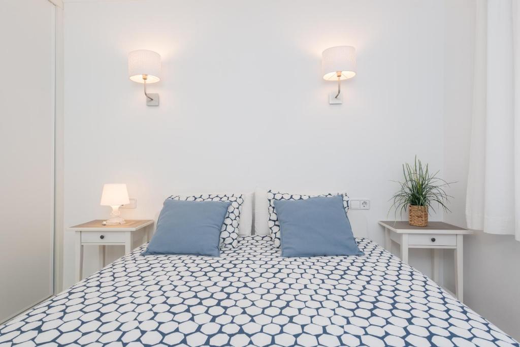 A bed or beds in a room at Apartamento Pinebeach
