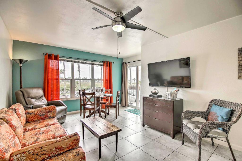 a living room with a couch and a tv at Beach Haven with Shared Amenities - Steps to Beach! in South Padre Island