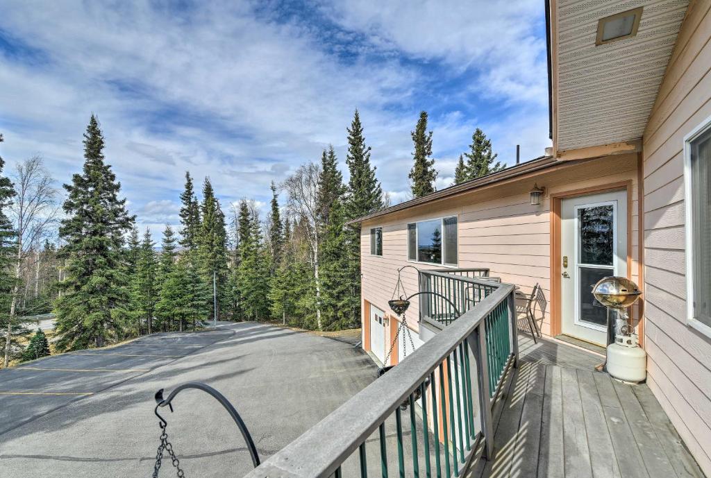 a balcony of a house with a driveway at Hillside Anchorage Home by Hiking and Biking Trails! in Anchorage