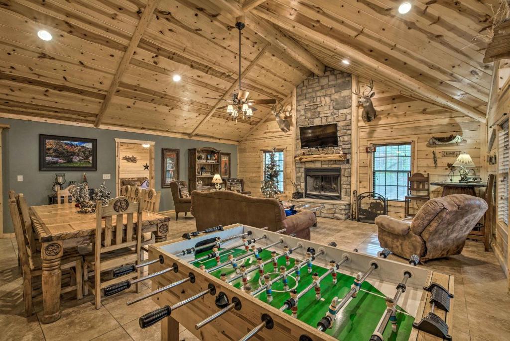 a living room with a pool table and a game room at Lavish Cabin Hot Tub and Deck, Near Broken Bow Lake in Broken Bow