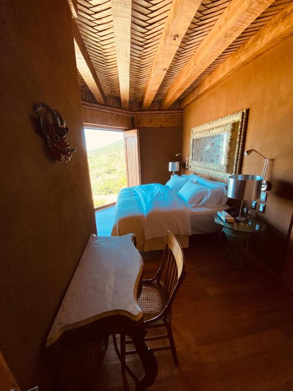 Postel nebo postele na pokoji v ubytování Hacienda Ucazanaztacua