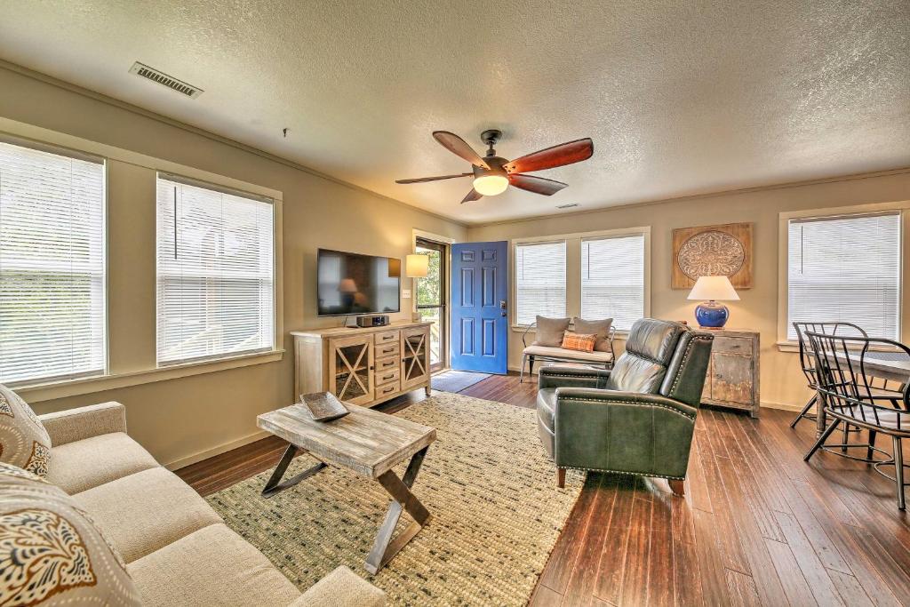 a living room with a couch and a ceiling fan at Cozy Cottage Less Than 2 Mi to Cape Hatteras Natl Shore! in Frisco