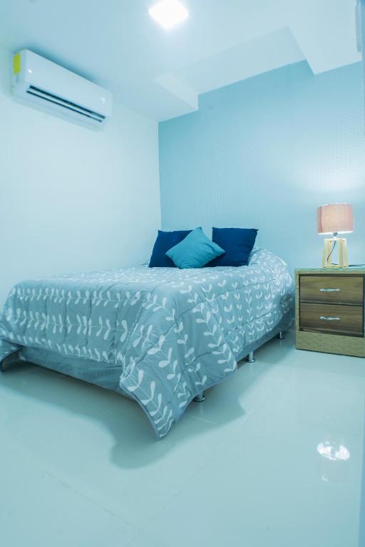 Postel nebo postele na pokoji v ubytování Malecon Premium Rooms & Hotel