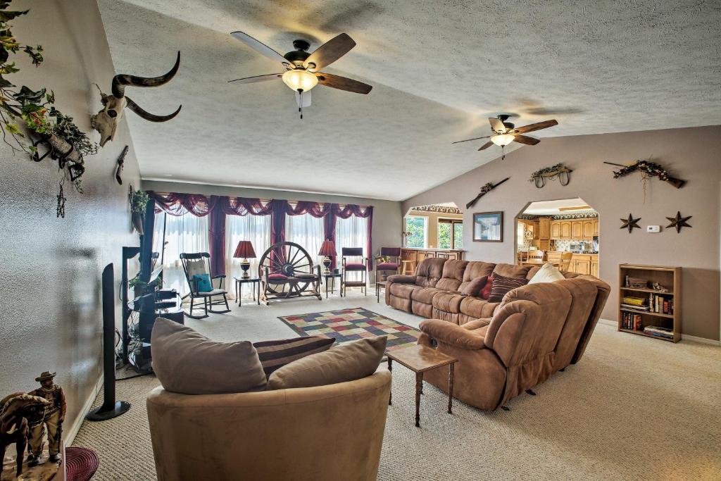 a large living room with couches and a table at Pet-Friendly, Lakefront Home in Golden with Patio! in Golden