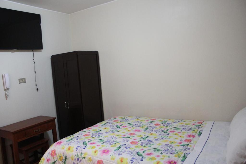 Postel nebo postele na pokoji v ubytování Hostal Inkanto Taruma