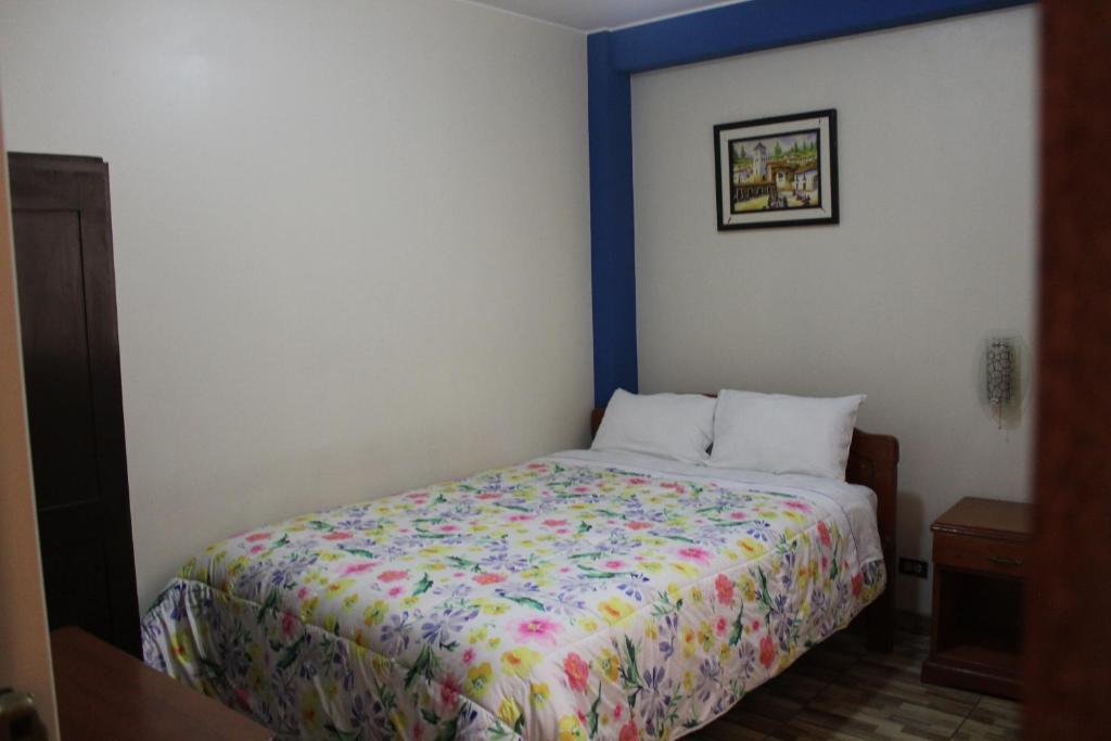Postel nebo postele na pokoji v ubytování Hostal Inkanto Taruma