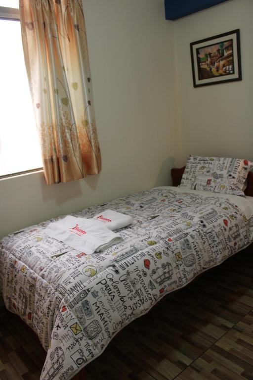 Postel nebo postele na pokoji v ubytování Hostal Inkanto Taruma